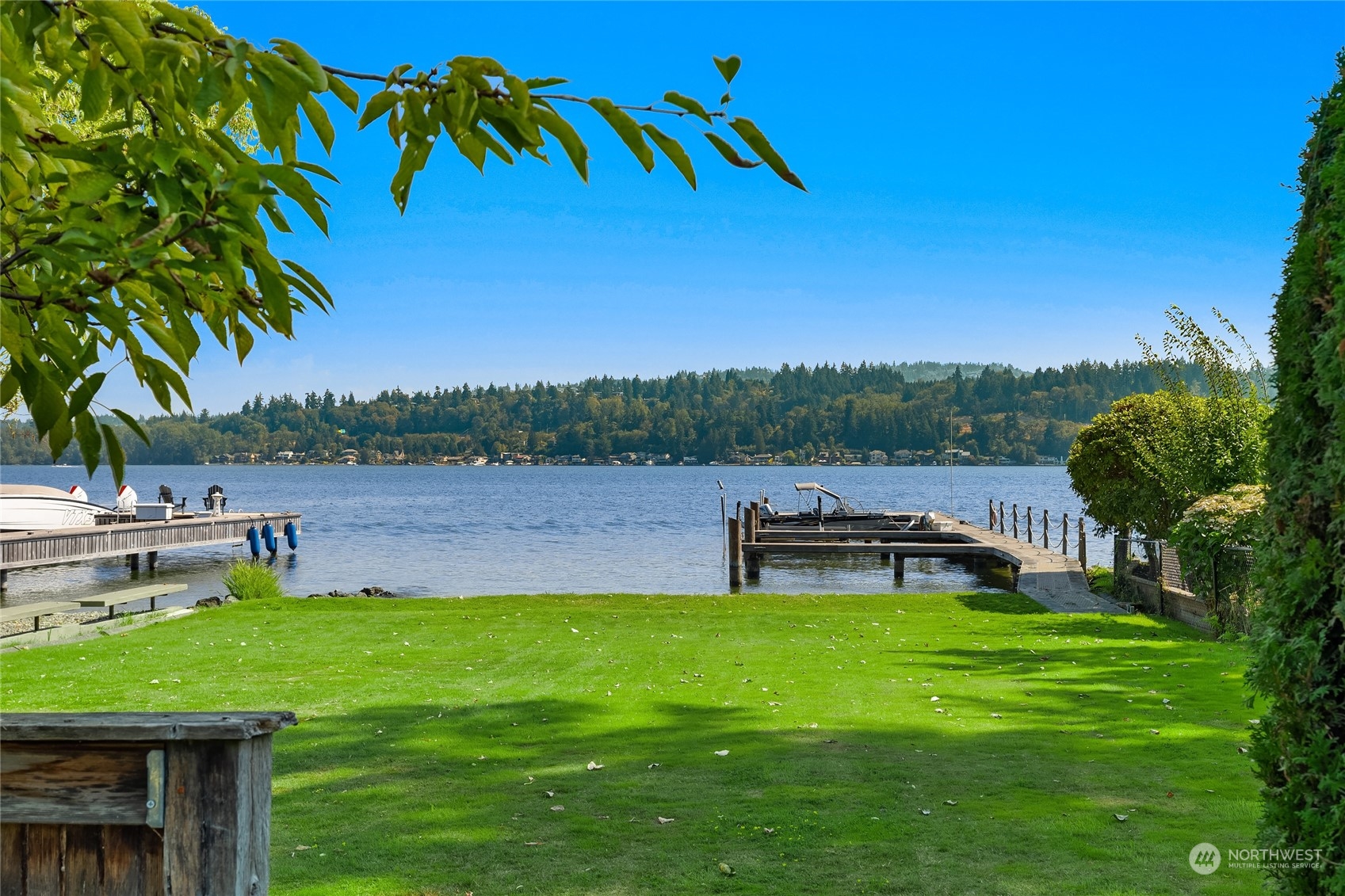 5300 Butterworth Road Mercer Island, WA 98040 - Photo 8 of 36 a view of a lake with a garden and trees