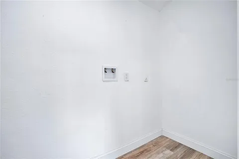 a view of a small space with wooden floor