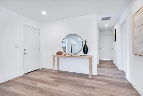 a view of living room with wooden floor