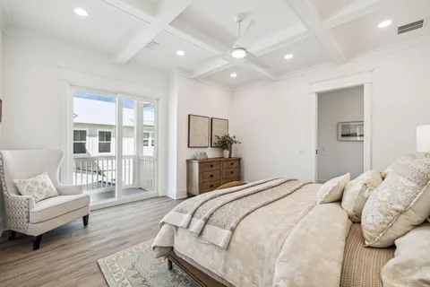 a bedroom with a large bed and a couch