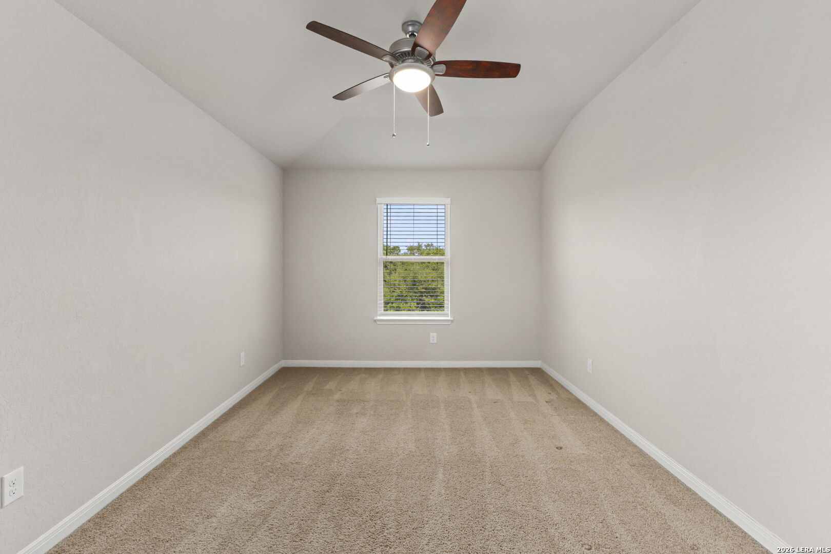 12221 Icon Ridge San Antonio, TX 78253 - Photo 27 of 46 an empty room with a window and a fan
