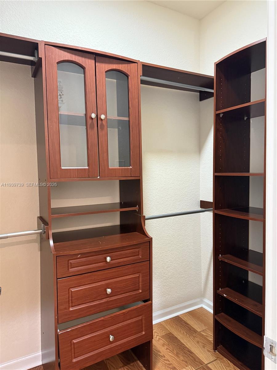 120 Cat Rock Lane Jupiter, FL 33458 - Photo 22 of 28 a view of closet with wooden floor