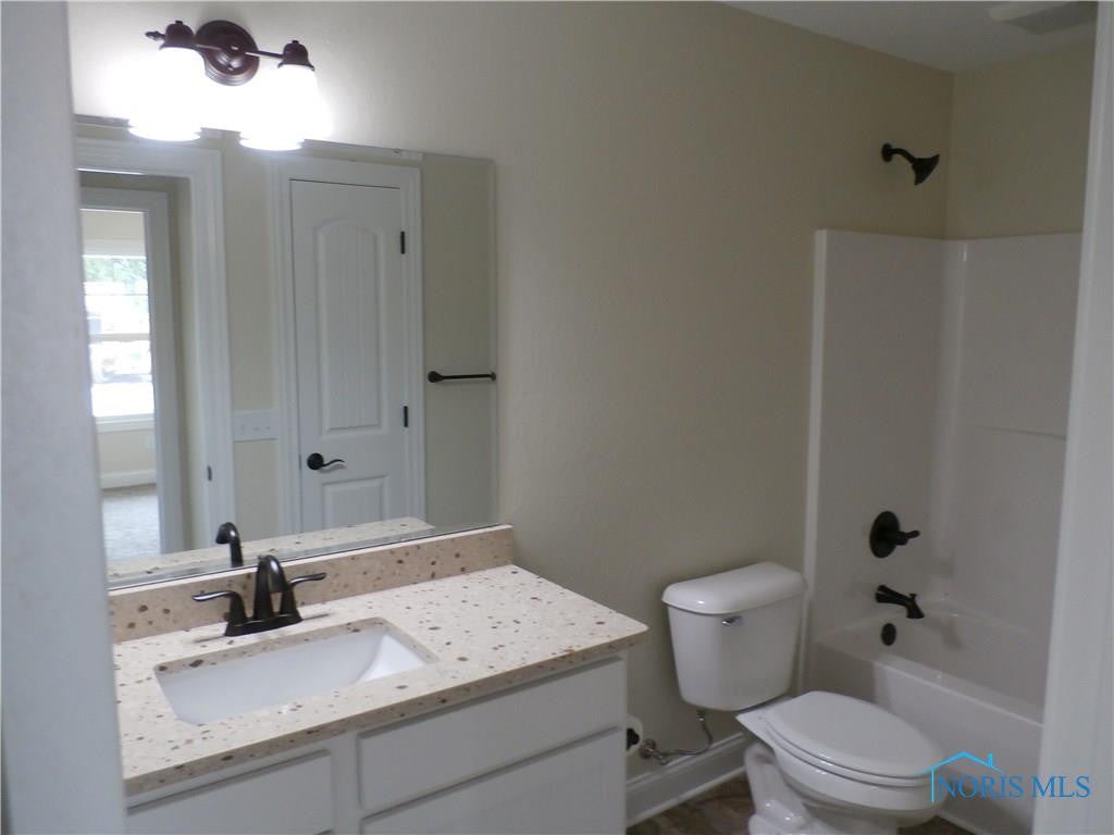 5912 Haefner Road Toledo, OH 43615 - Photo 10 of 19 Guest bath w/ Quartz top and Bronze Fixtures