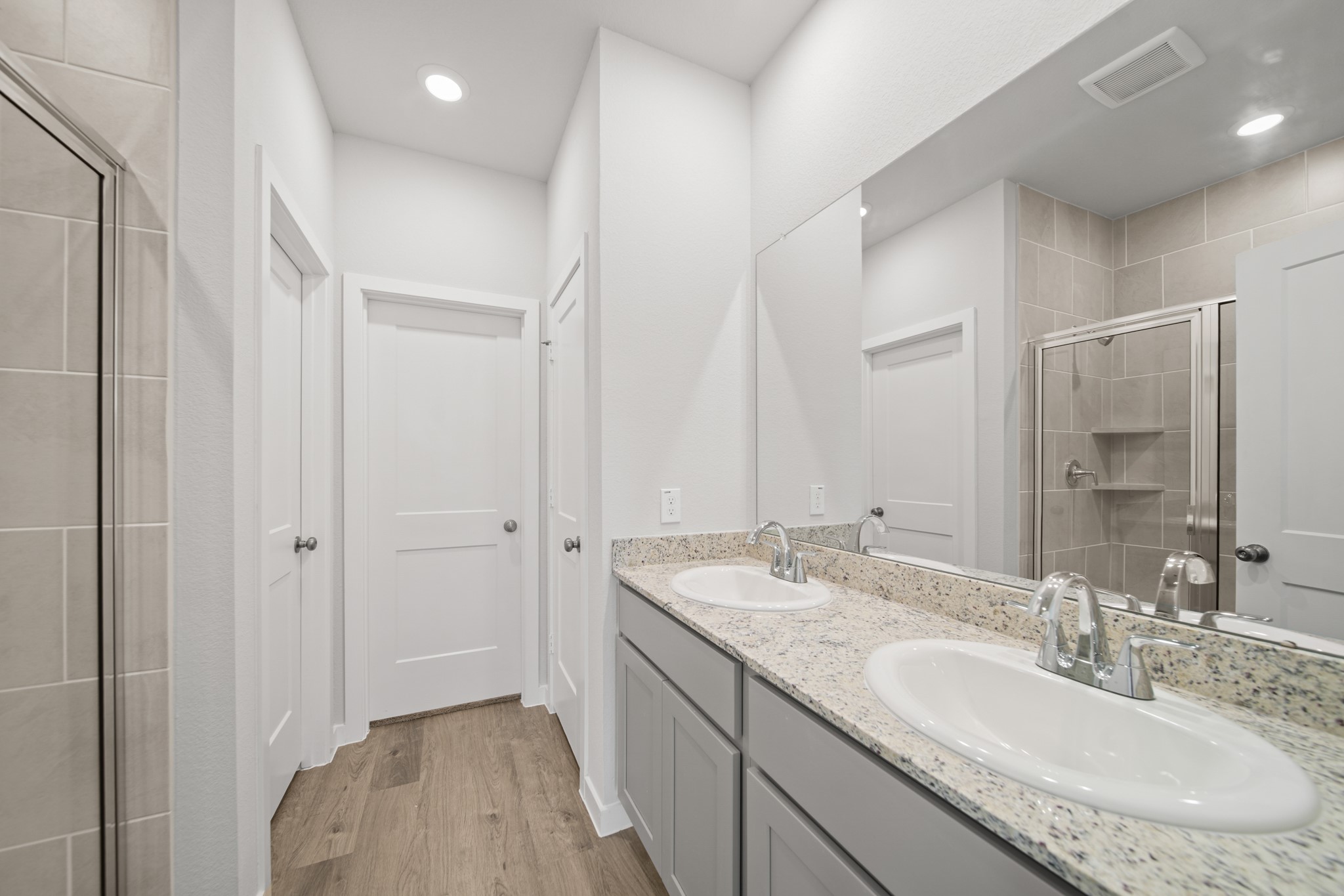 305 Bennett Street Angleton, TX 77515 - Photo 11 of 27 a bathroom with a granite countertop sink and a mirror