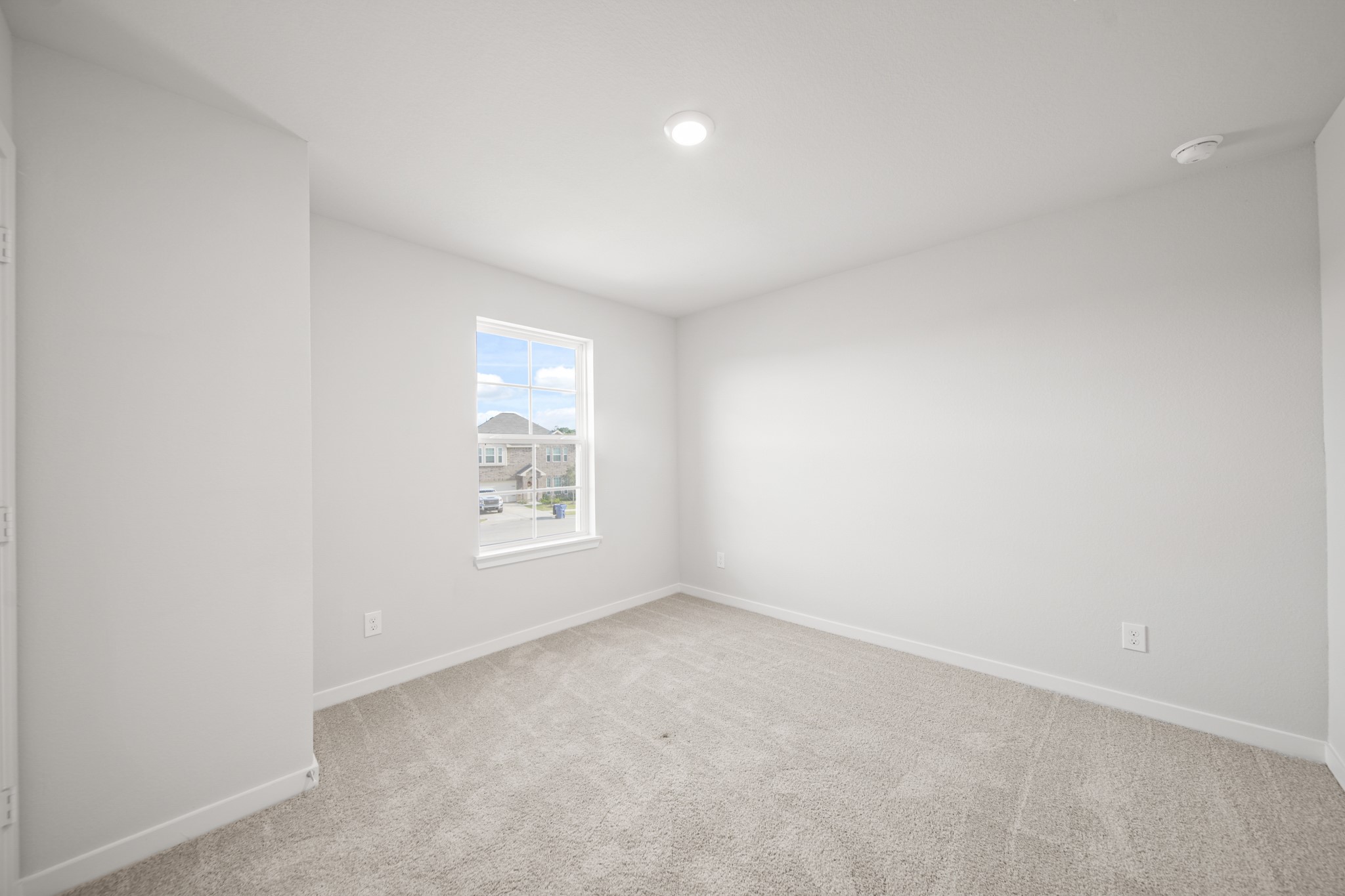 305 Bennett Street Angleton, TX 77515 - Photo 16 of 27 an empty room with a window