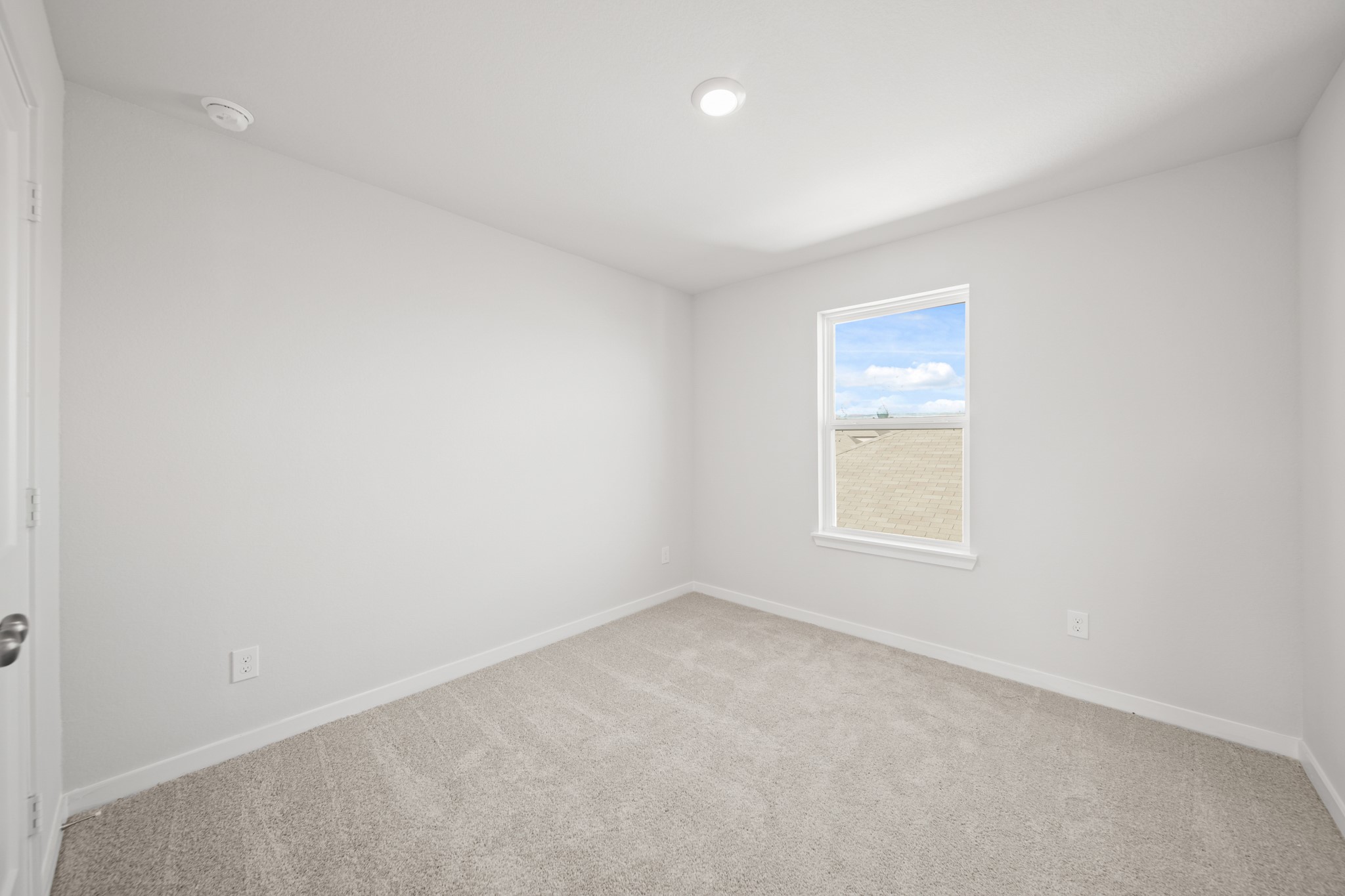 305 Bennett Street Angleton, TX 77515 - Photo 17 of 27 an empty room with a window