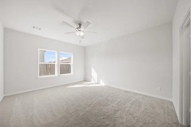 a view of empty room with windows