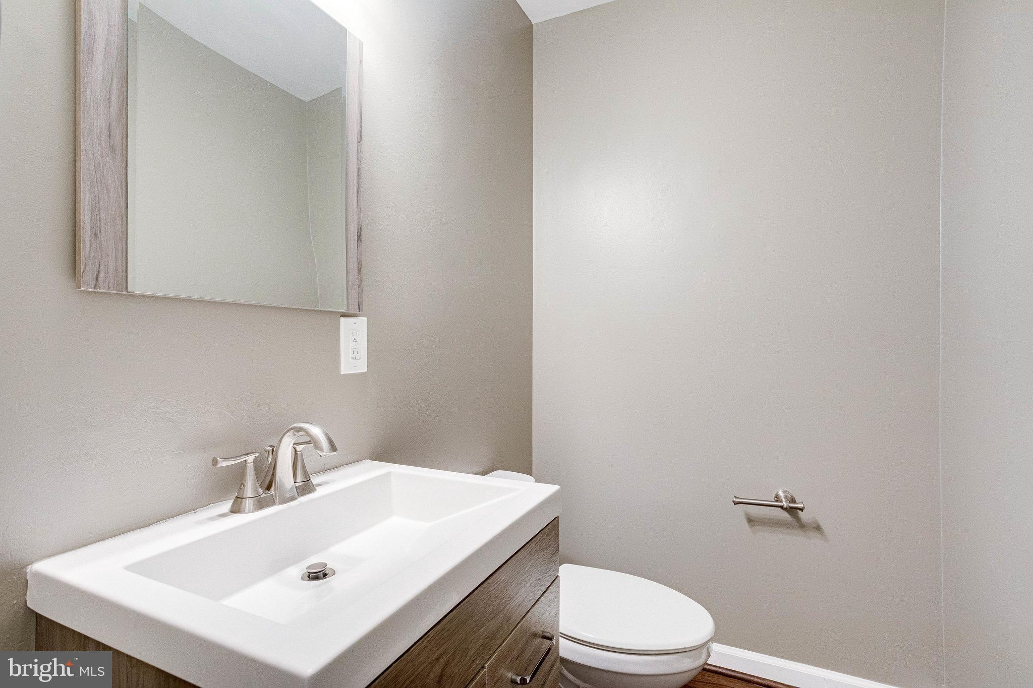 2648 Bowen Road Southeast Washington, DC 20020 - Photo 17 of 36 a white toilet sitting next to a white sink