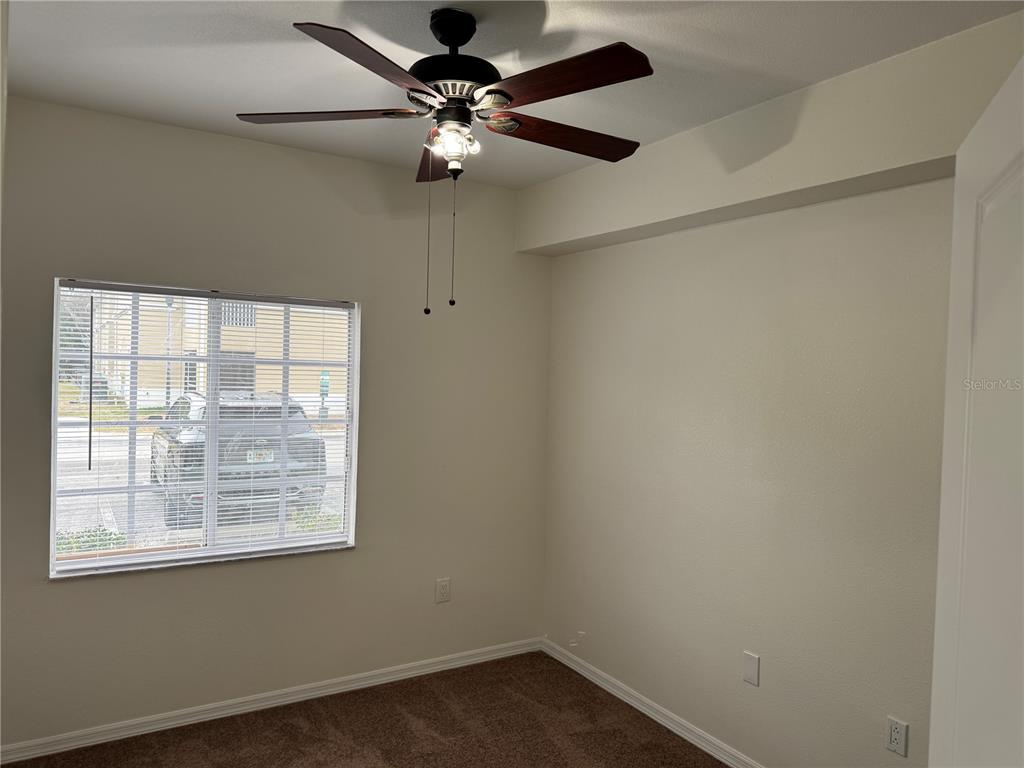 9515 Grovedale Circle, Unit 101 Riverview, FL 33578 - Photo 17 of 22 an empty room with a window