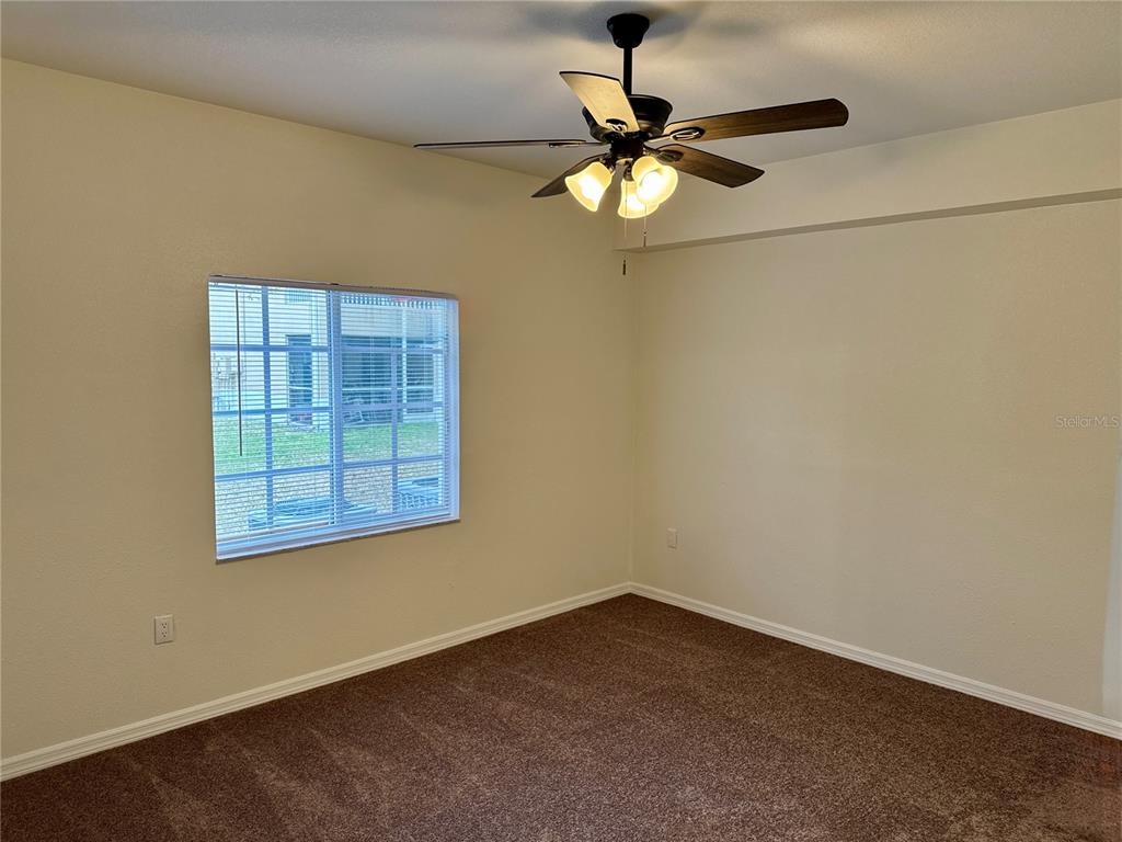 9515 Grovedale Circle, Unit 101 Riverview, FL 33578 - Photo 10 of 22 an empty room with a window