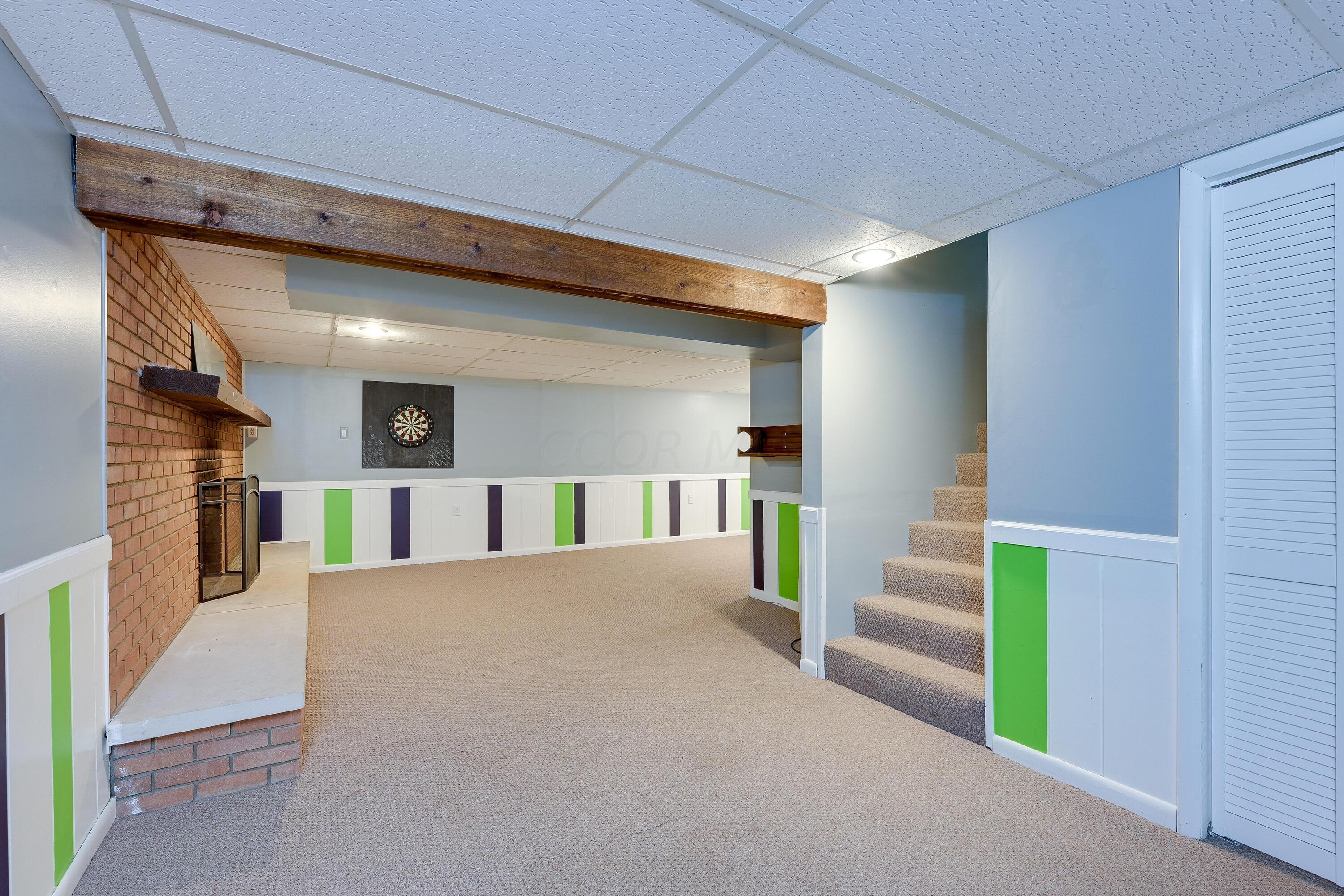 5383 Pine Bluff Road Columbus, OH 43229 - Photo 24 of 32 Lower level Rec Room with Decorative fireplace