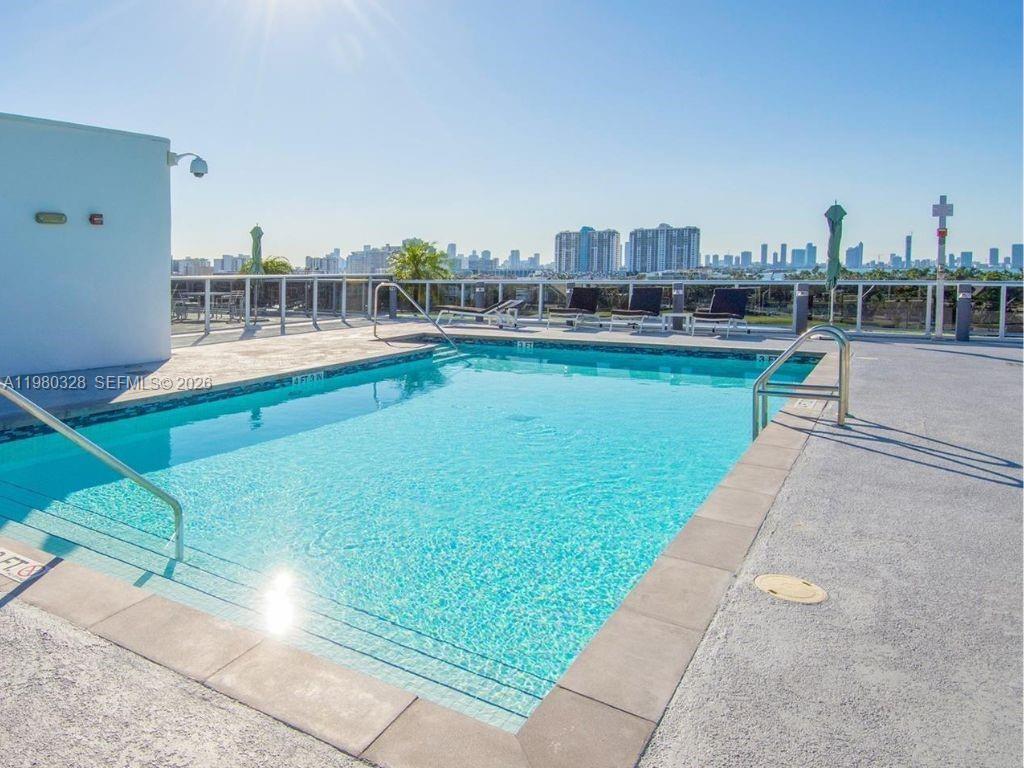 2001 Meridian Avenue, Unit 414 Miami Beach, FL 33139 - Photo 19 of 22 a view of a swimming pool with a yard