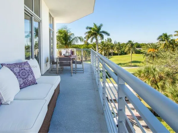 a balcony with furniture and a view of balcony