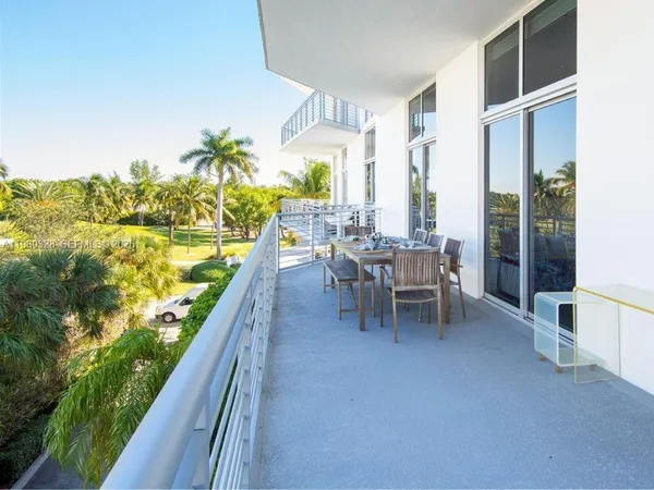 a dining room with furniture and garden view