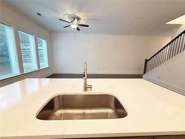 a kitchen with a sink and a window