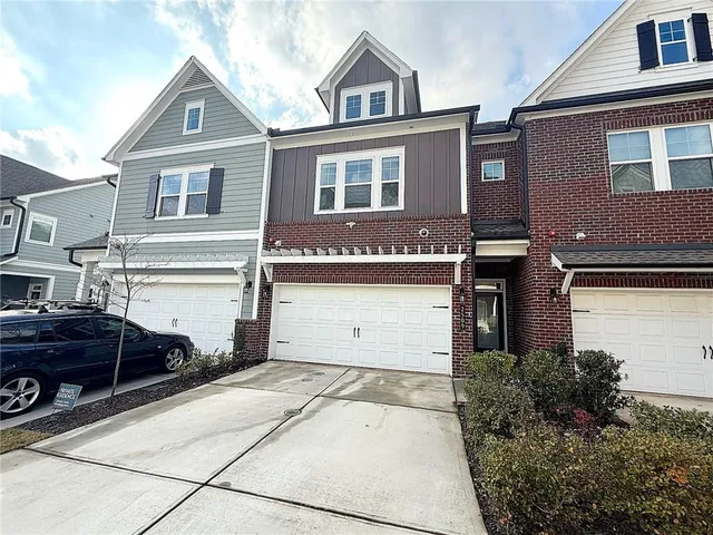a front view of a house with a garage