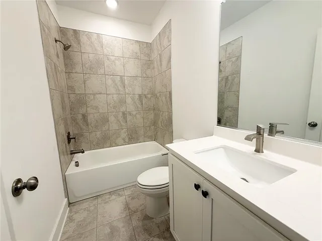a bathroom with a sink a toilet and a bathtub