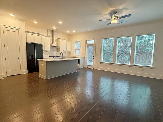 a view of a kitchen with a stove cabinets and wooden floor