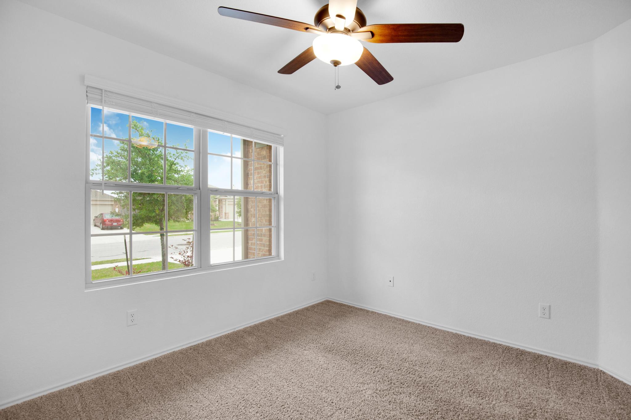 21409 Resource Road Pflugerville, TX 78660 - Photo 16 of 23 Empty room featuring a ceiling fan and carpet flooring