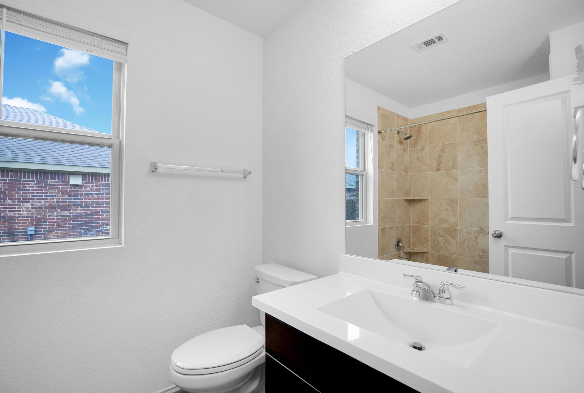 21409 Resource Road Pflugerville, TX 78660 - Photo 17 of 23 Full bathroom featuring vanity and a shower