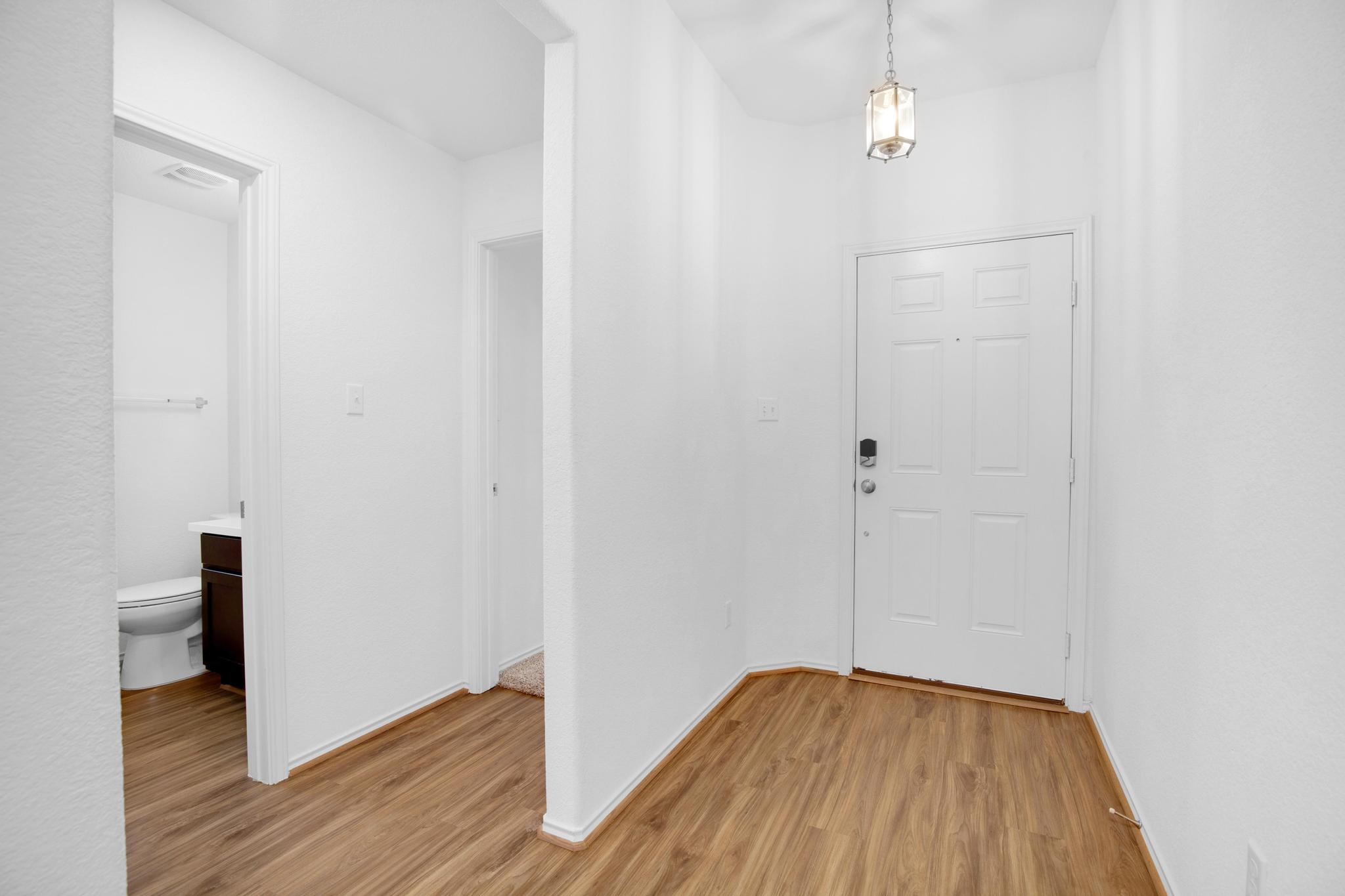 21409 Resource Road Pflugerville, TX 78660 - Photo 19 of 23 Foyer entrance with light wood-type flooring and baseboards