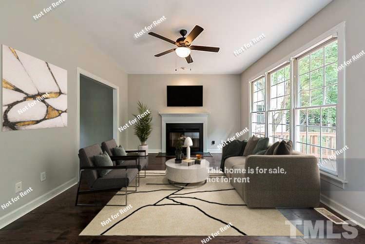 8528 Yucca Trail Raleigh, NC 27615 - Photo 2 of 21 a living room with furniture fireplace and window