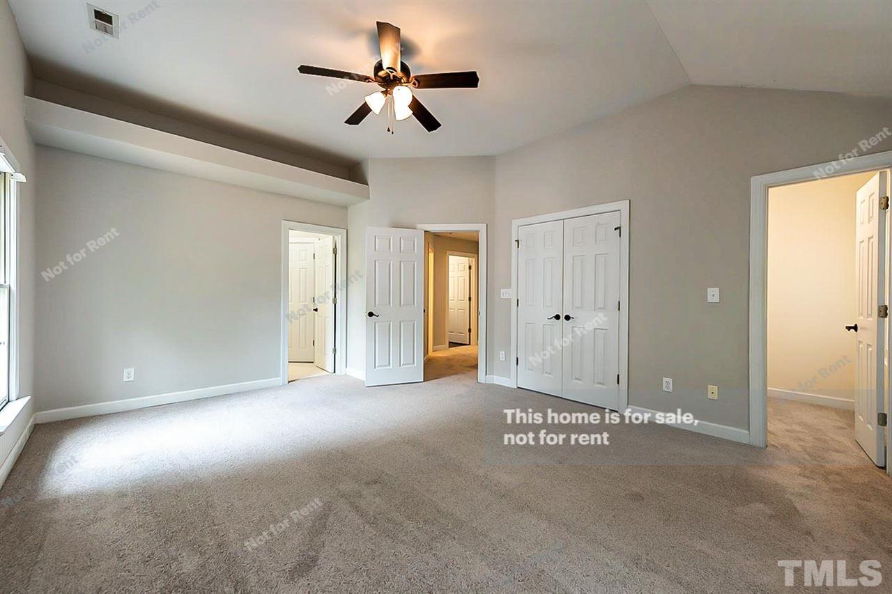 8528 Yucca Trail Raleigh, NC 27615 - Photo 15 of 21 a view of a livingroom with a ceiling fan
