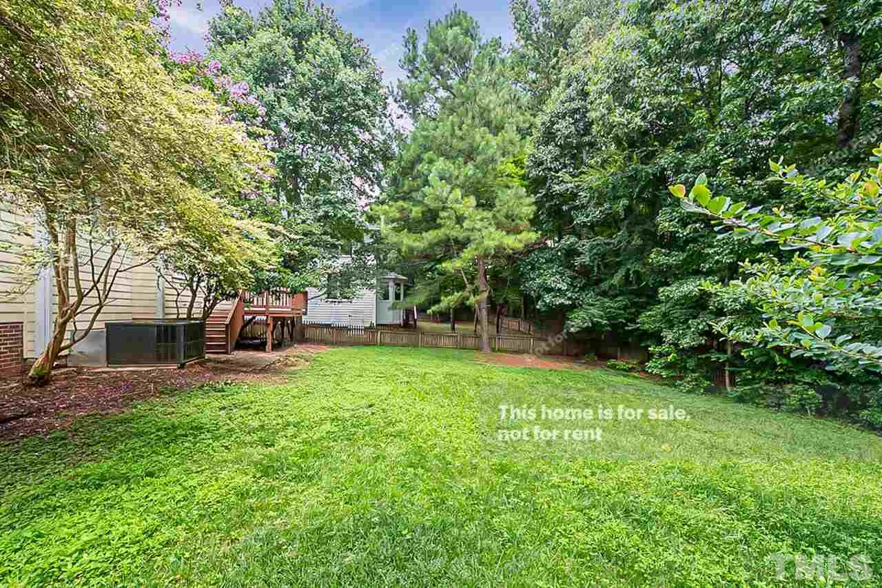 8528 Yucca Trail Raleigh, NC 27615 - Photo 19 of 21 a backyard of a house with table and chairs