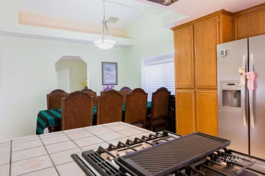 642 Regency Court Ridgecrest, CA 93555 - Photo 15 of 33 a bed room with a bed and dresser