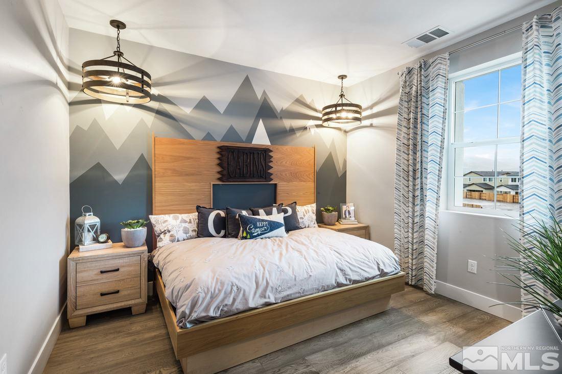 2207 Willow Ridge Road, Unit HOMESITE 3 Reno, NV 89521 - Photo 13 of 24 a bedroom with a bed and a chandelier