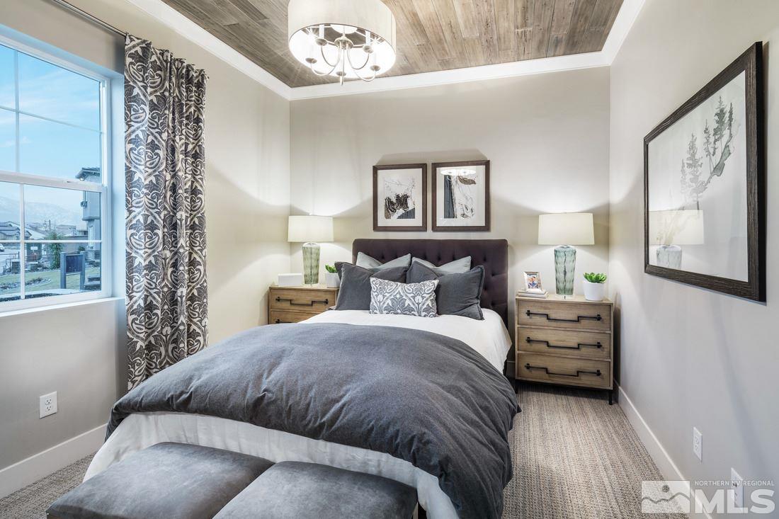 2207 Willow Ridge Road, Unit HOMESITE 3 Reno, NV 89521 - Photo 15 of 24 a bedroom with a bed and a chandelier