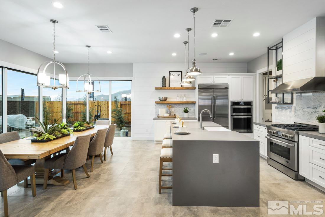2207 Willow Ridge Road, Unit HOMESITE 3 Reno, NV 89521 - Photo 2 of 24 a large kitchen with a table and chairs