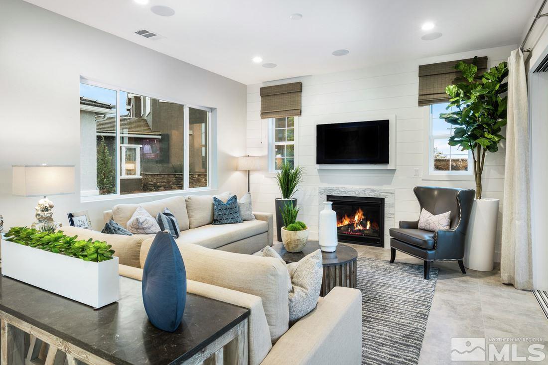 2207 Willow Ridge Road, Unit HOMESITE 3 Reno, NV 89521 - Photo 6 of 24 a living room with furniture a fireplace and a flat screen tv
