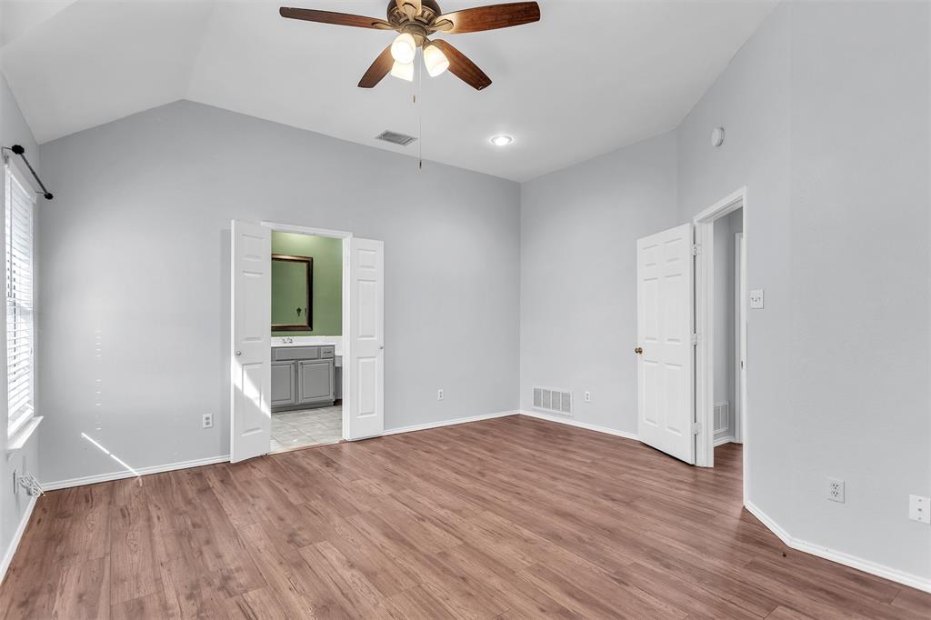 6613 Springmeadow Lane Rowlett, TX 75089 - Photo 11 of 20 wooden floor in an empty room with a window