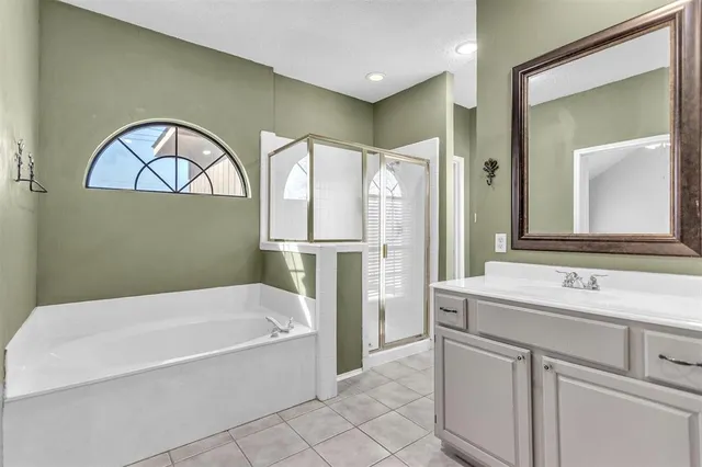 a bathroom with a bathtub and a sink