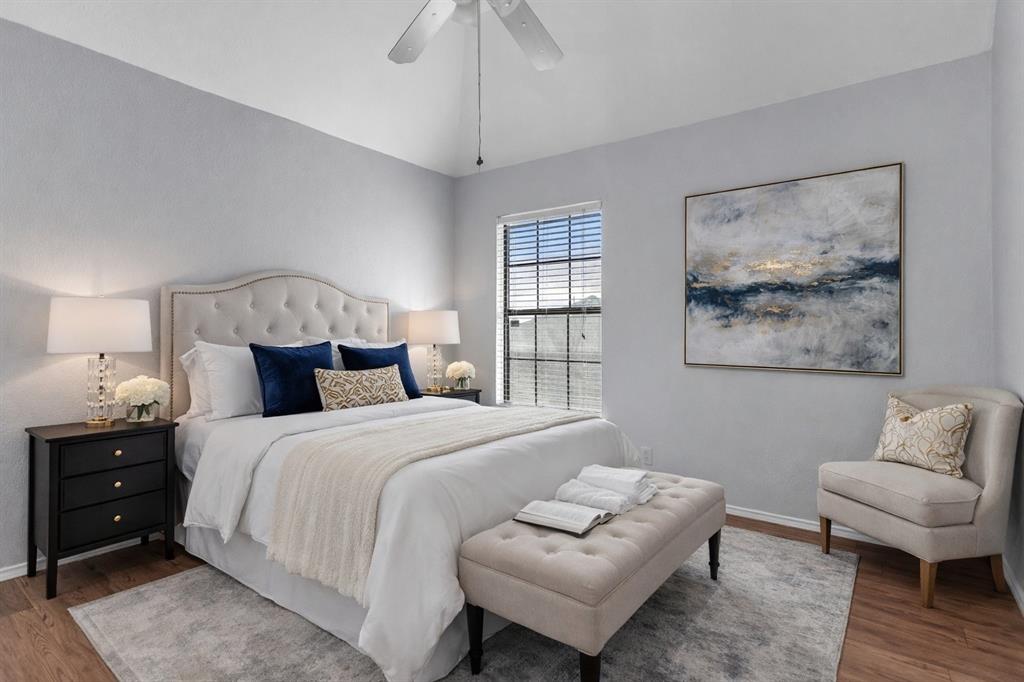 6613 Springmeadow Lane Rowlett, TX 75089 - Photo 17 of 20 a bedroom with a bed and a couch