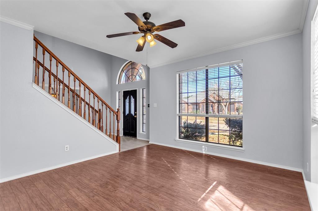 6613 Springmeadow Lane Rowlett, TX 75089 - Photo 18 of 20 a view of an empty room with wooden floor and a window