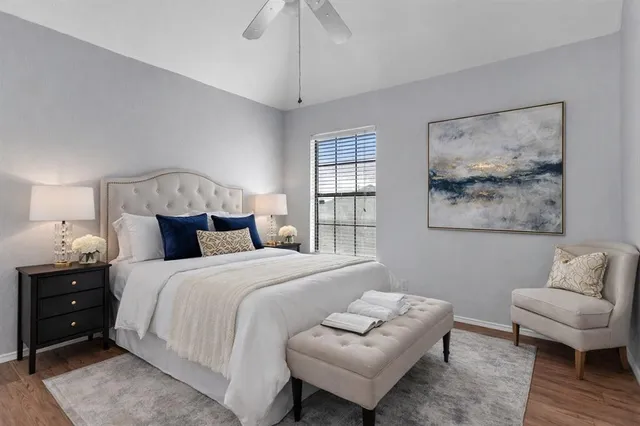 a bedroom with a bed and a couch