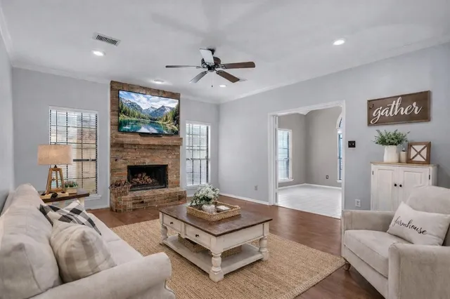 a living room with furniture and a fireplace