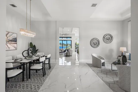 a kitchen with kitchen island a large counter top space a sink stainless steel appliances and cabinets