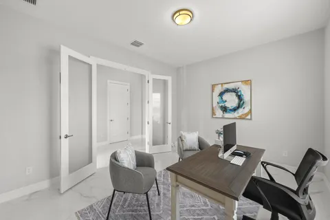 a living room with furniture and a window