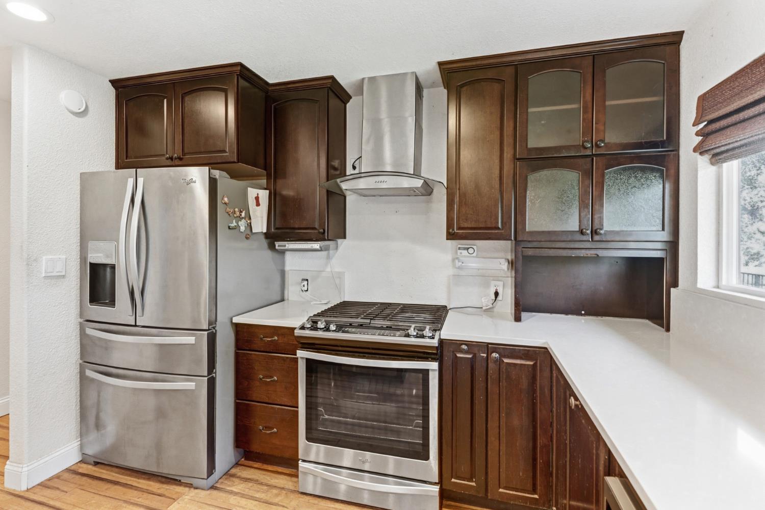 4330 Cavitt Stallman Road Granite Bay, CA 95746 - Photo 18 of 85 a kitchen with stainless steel appliances granite countertop a refrigerator stove and sink