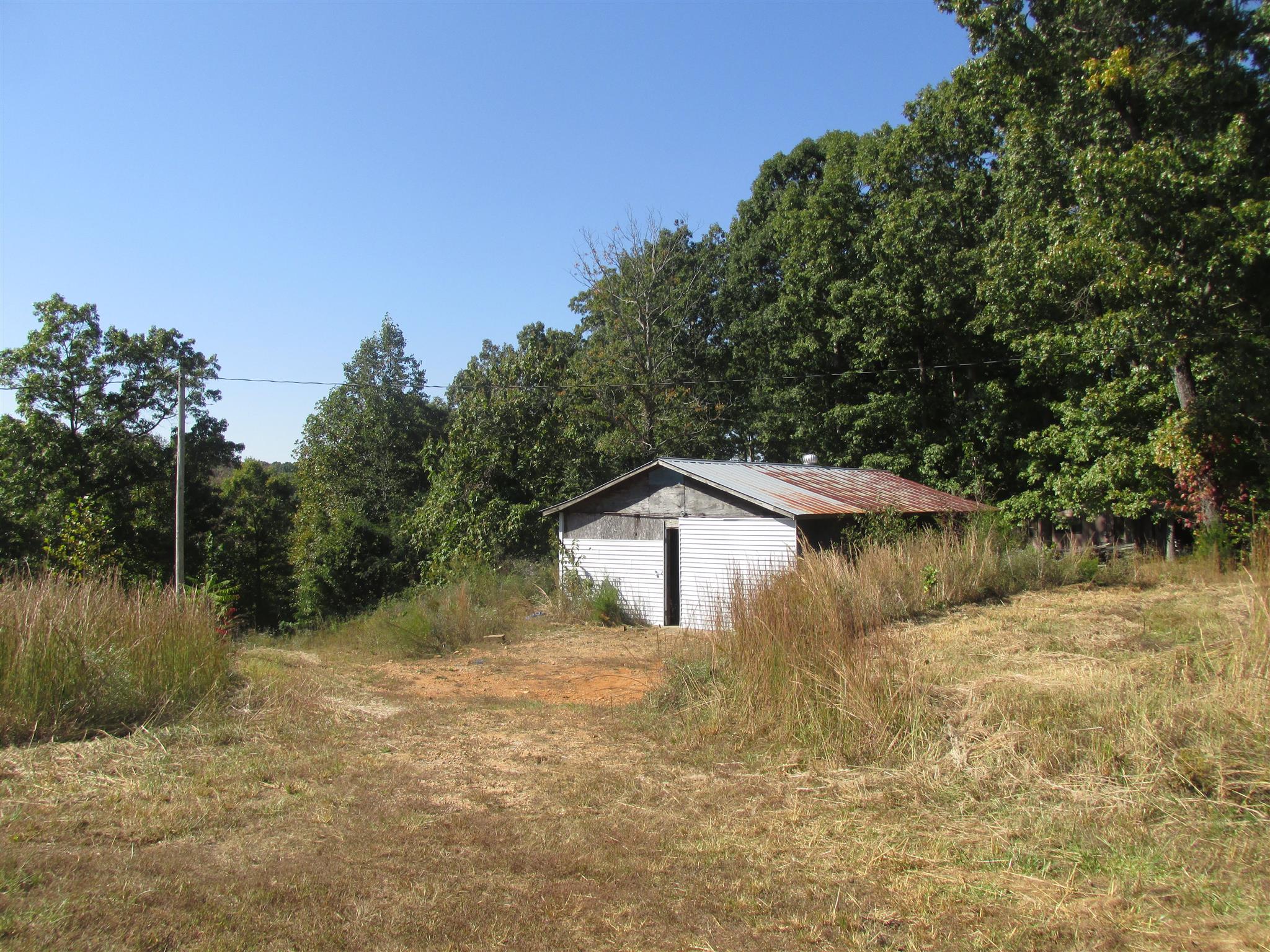 997 Pack Road White Bluff, TN 37187 - Photo 4 of 11 a view of a lake with a house in the background