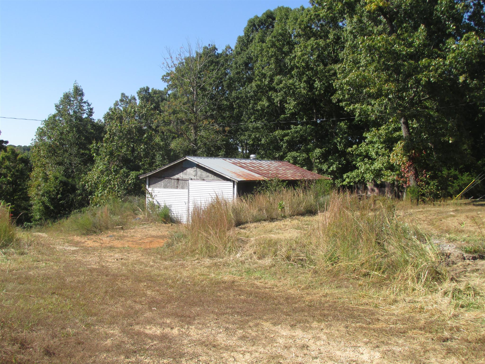 997 Pack Road White Bluff, TN 37187 - Photo 6 of 11 a view of a houses with yard and lake view