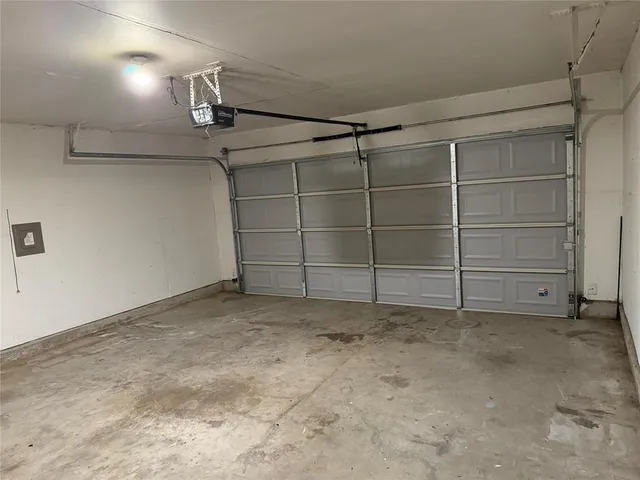 a bathroom with a shower and mirror