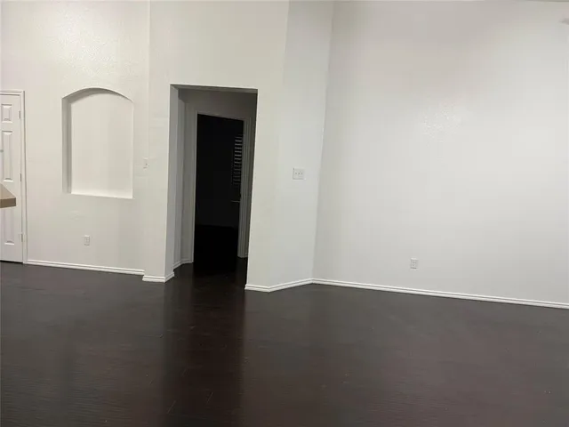 a hallway with wooden floor