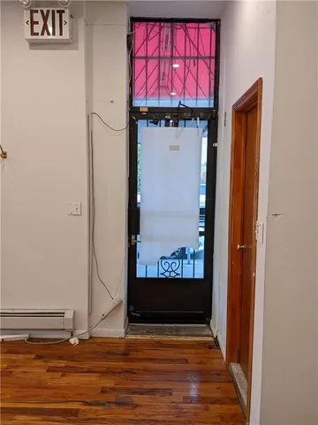a bathroom with a toilet and a mirror