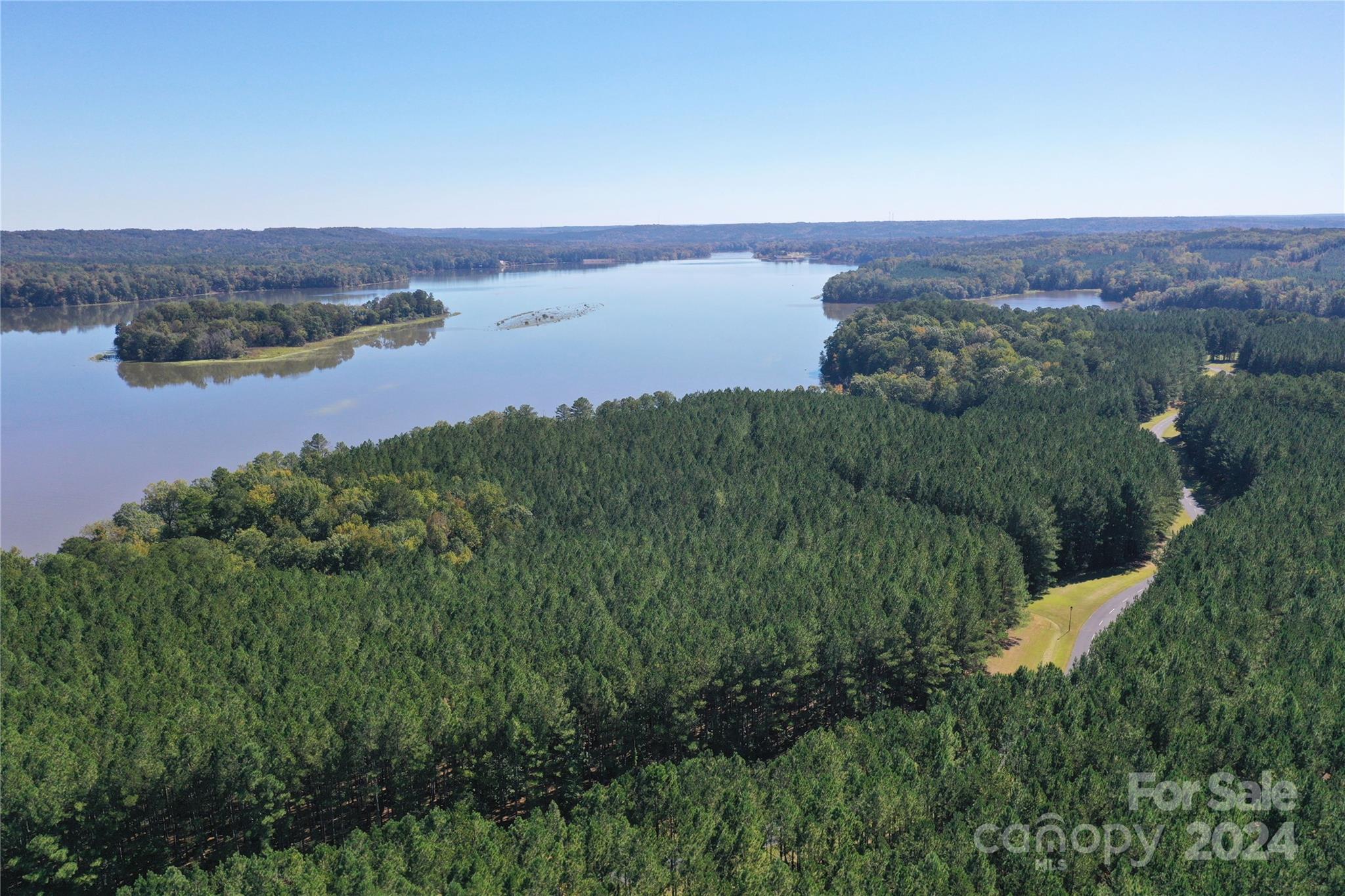 Tbd Tbd Spencer Pointe Road, Unit LOT 21A Lilesville, NC 28091 - Photo 14 of 16 an aerial view of a houses with a lake