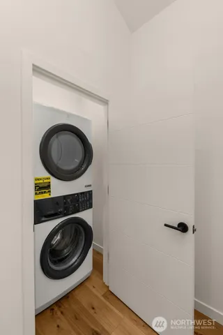 a view of a storage and utility room with a washer and dryer