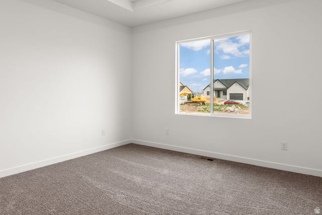 1417 West 2350th South, Unit 14 Perry, UT 84302 - Photo 8 of 19 Neutral white walls complement the gray carpeting in this room